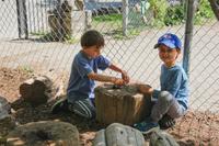 two kinder boys playing together outside