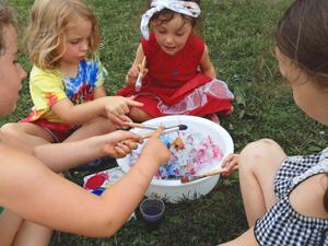 children painting ice together
