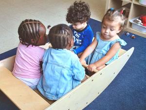 toddlers playing in a box