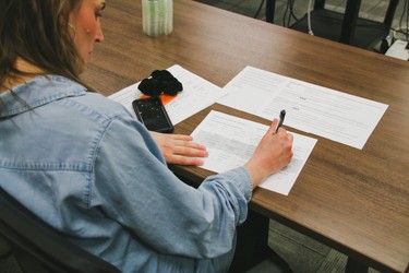 a cook annotating the spring/summer 2022 menu