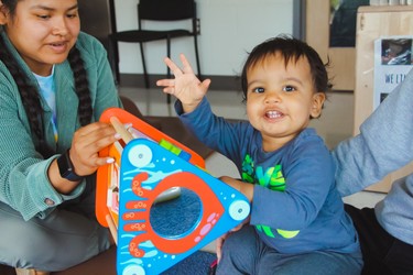 child playing with spinny toy