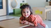 infant girl smiling