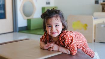 infant girl smiling