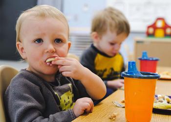 toddler enjoying lunch