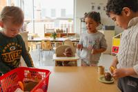 preschool children playing with toy food