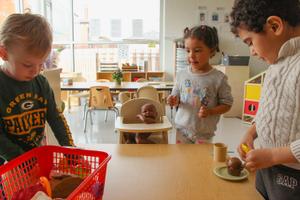 preschool children playing with toy food