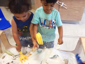 two children playing with sand