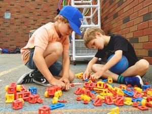 two little boys playing with blocks