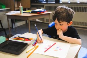 school age boy colouring