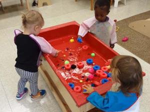 toddlers playing with water