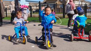 preschoolers playing on bikes