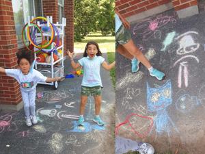 children playing with chalk outside