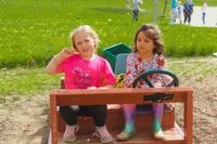 two kinder friends playing outside