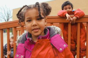 preschoolers smiling outside